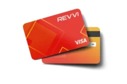Revvi Visa credit card with red and orange geometric design, showing both front and back.