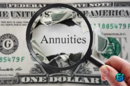 Magnifying glass highlighting the word “Annuities” on a torn dollar bill.