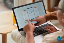 Two people comparing subscription plans on a laptop screen.