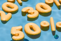 Yellow numbers representing the 50/30/20 budget rule floating on blue water.