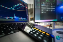 Laptop showing stock market charts during a financial bubble.