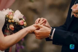 Close-up of a couple exchanging rings during weddings ceremony.