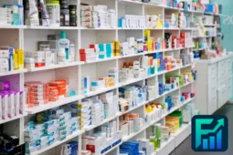 Interior view of a brightly lit pharmacy aisle with shelves full of health products and medications, illustrating the options in a pharmacy vs. supermarket comparison.