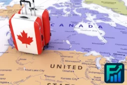 Suitcases with Canadian flags on a map of Canada, representing Vacations in Canada.