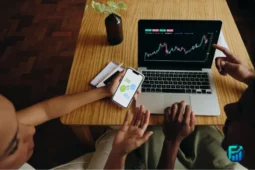 Canadian millennials analysing OpenAI Stock trends on a laptop and phone with trading options.