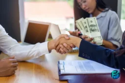 Handshake over a loan agreement, representing approval of bad credit loans.