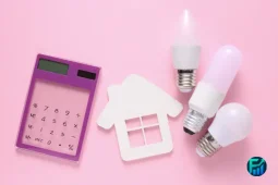 Calculator and light bulbs showing ways to save on hydro