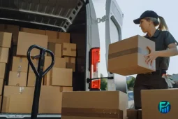 Gig worker taxes Canada worker loading delivery boxes into a van during a work shift.