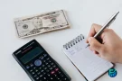 Emergency loans calculation with cash and calculator.