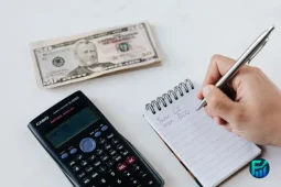 Emergency loans calculation with cash and calculator.